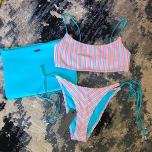 Sport style top and string bottom swimsuit set with bag.